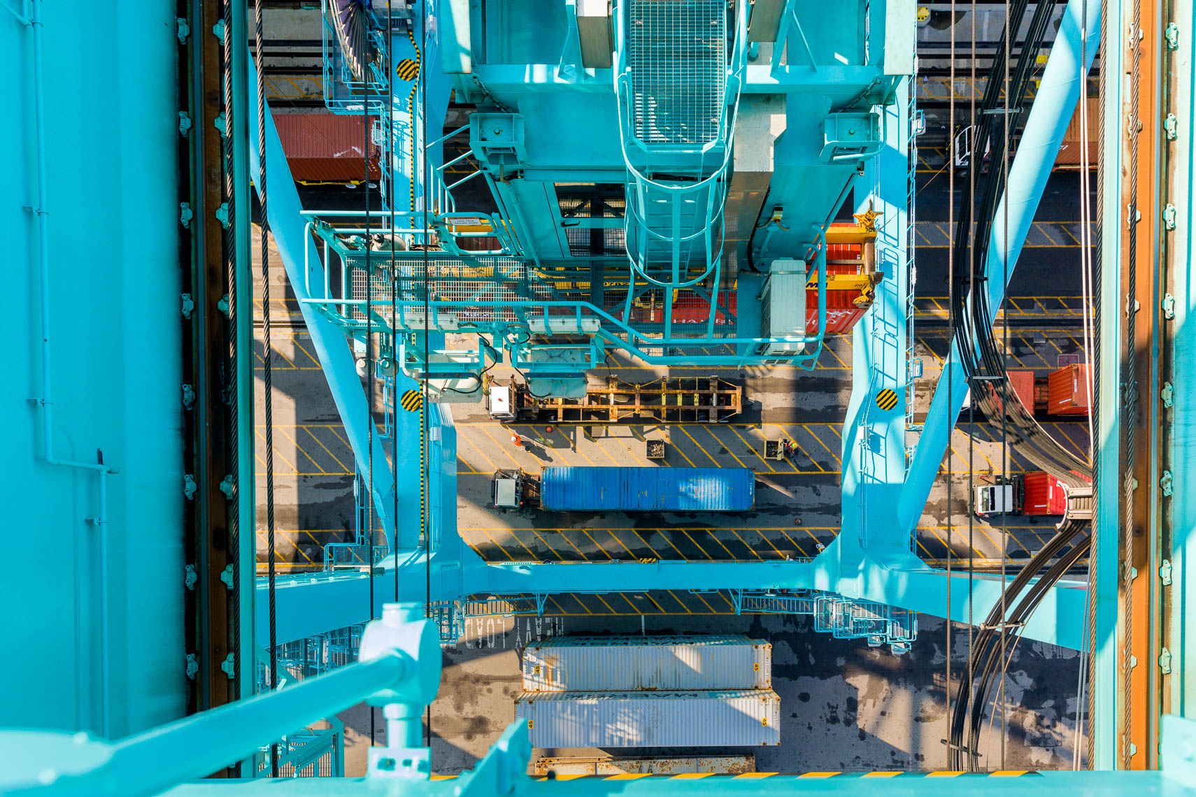 Overhead view of a crane loading containters onto a cargo ship at JAXPORT
