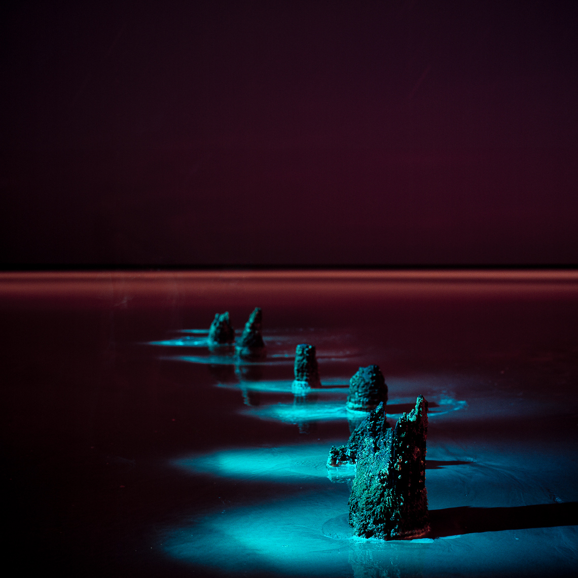 Light painted structures in the water at night