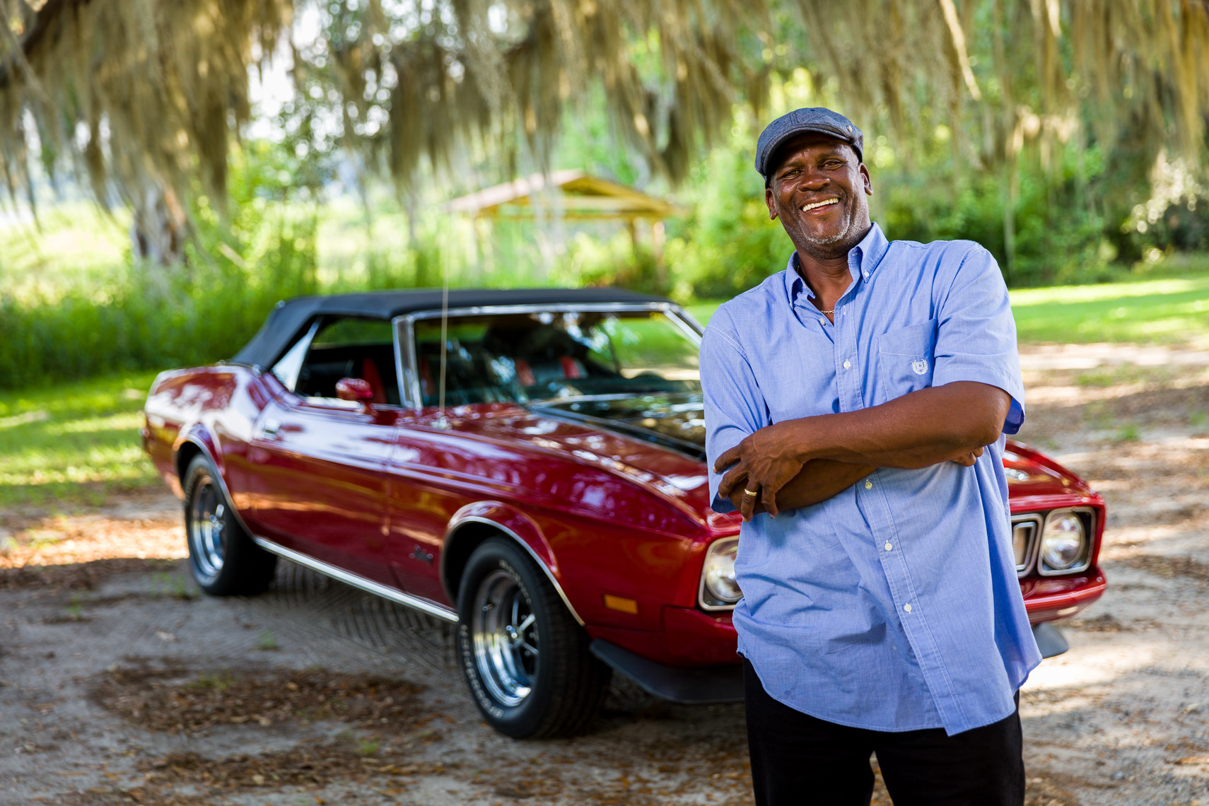Portrait of a car Owner and his Red 1973 Mustang Convertible