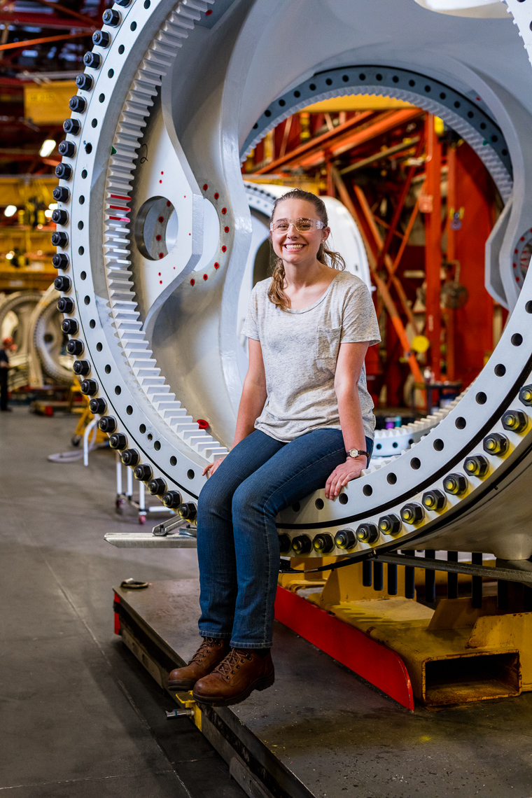 Portrait of a female employee at a tech company in an inustrial warehouse